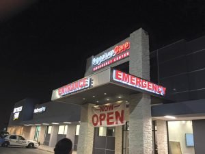 Sign Shop channel letters banner outdoor storefront building illuminated backlit sign 300x225